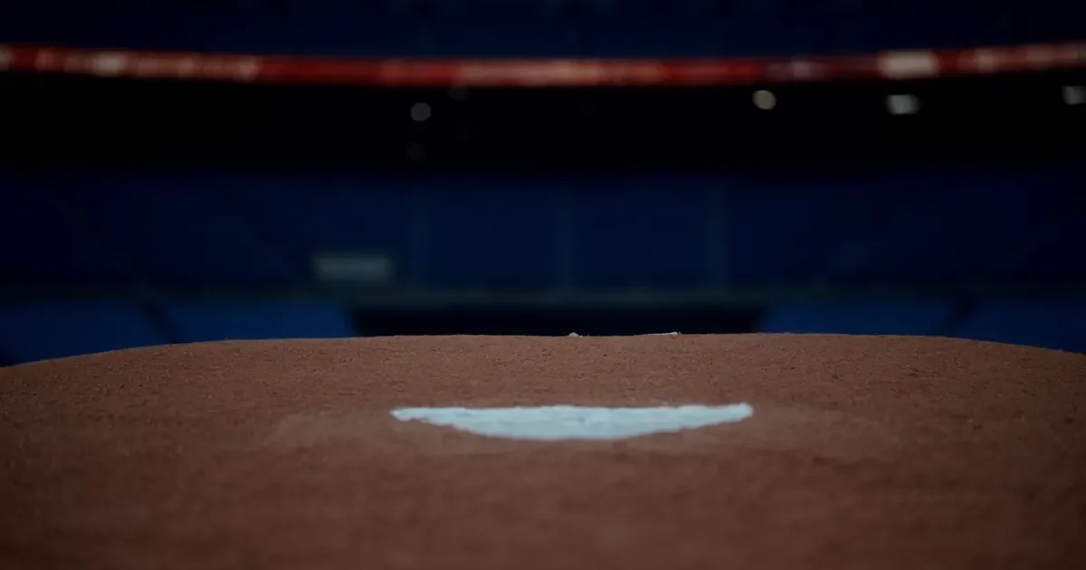 The pitcher's mound and rubber in an empty ballpark, low angle